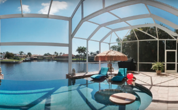 Example picture of a pool lanai with a picture window installed facing the canal.