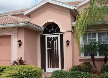 Picture of a residential aluminum front entry way decorative screen enclosure in Broward County.